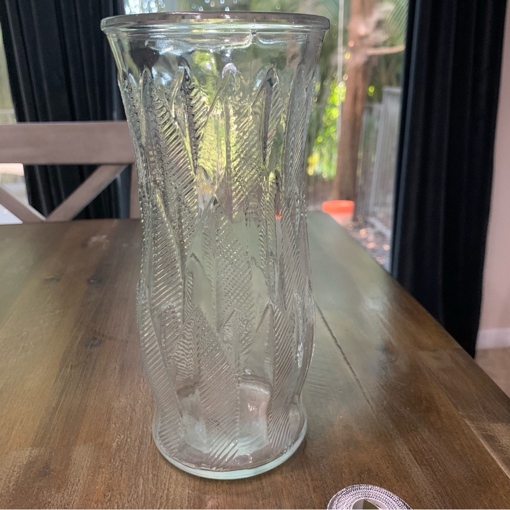 Clear glass floral vase with etched design